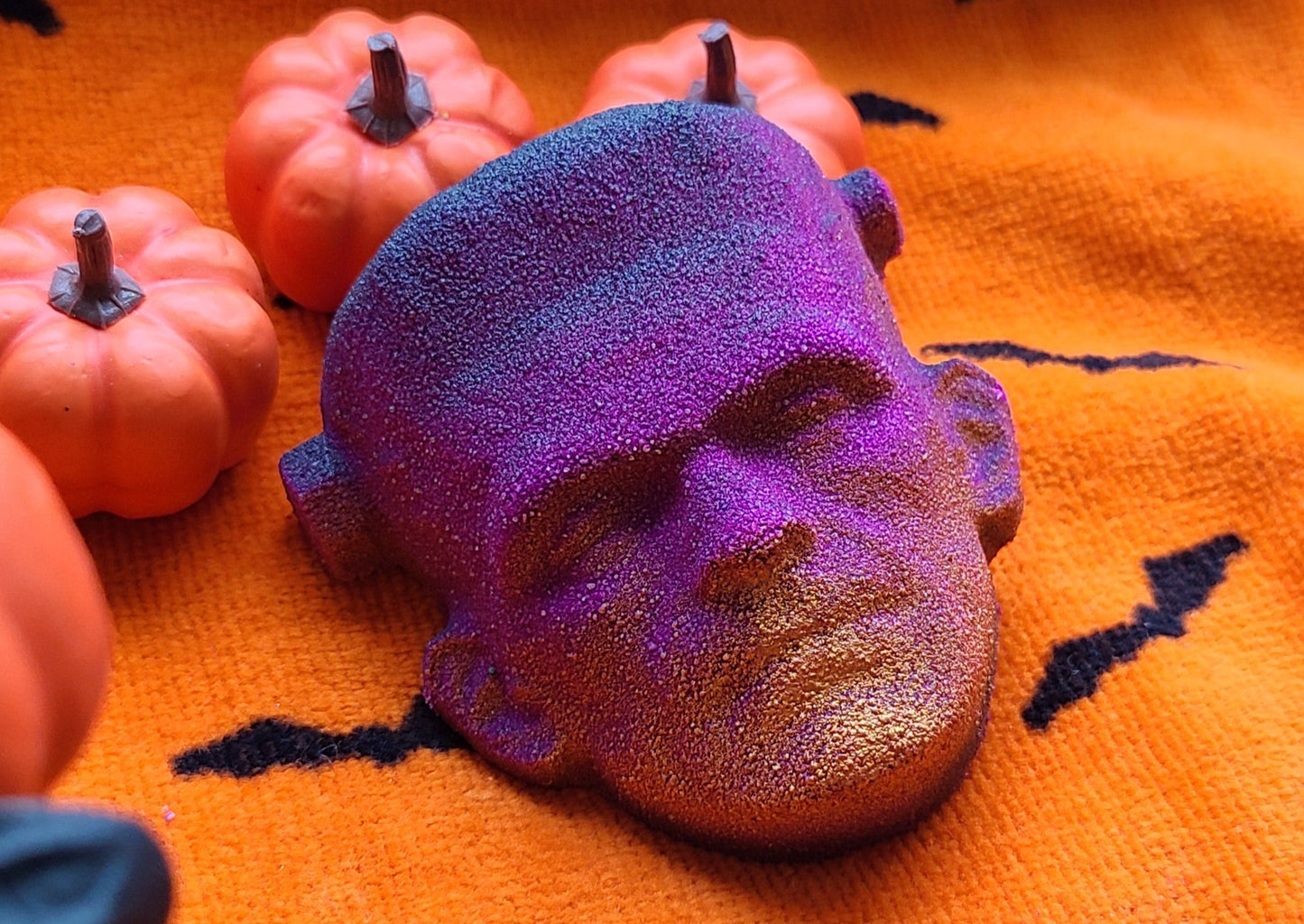 Dark Pink and gold Frankenstein face bath bomb